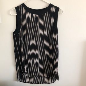 Black and white sleeveless blouse
